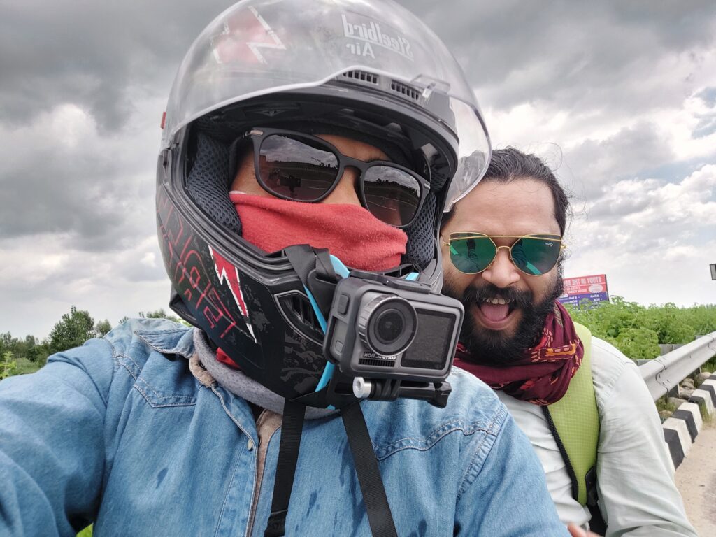 My First Travel Adventure: Delhi to Rishikesh on a Bike This snapshot marks a unique start—a two-wheeler trip from Delhi to Rishikesh with my friend Apurva that became my first-ever travel vlog. Setting off on my two-wheeler, I felt a mix of emotions: excitement, nervousness, and a deep sense of adventure. This wasn't just a road trip but the start of my journey as a travel vlogger. With Apurva riding along and the open road ahead, each mile was filled with new experiences and beautiful scenery. I wanted to capture every moment, twist, and turn to share the thrill of travel with others. This picture perfectly captures that moment with us smiling under the cloudy sky. It was the start of a dream, a leap into storytelling, and an unforgettable adventure that sparked my passion for travel vlogging.